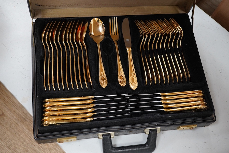 A Bestecke Solingen gold plated canteen of cutlery. Condition - good, one piece missing